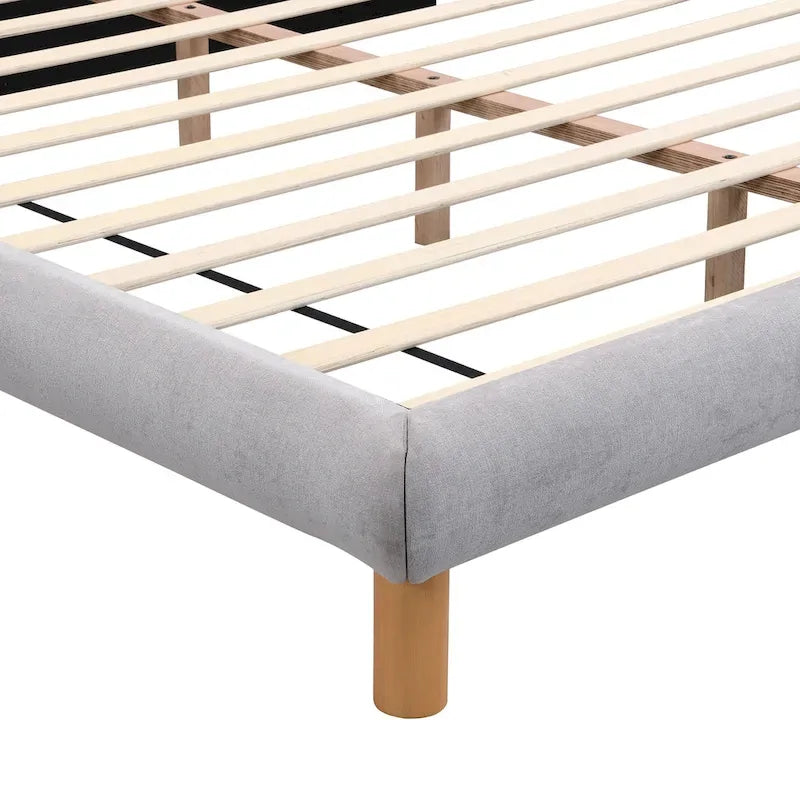 Lit plateforme rembourré format King avec tête de lit ronde