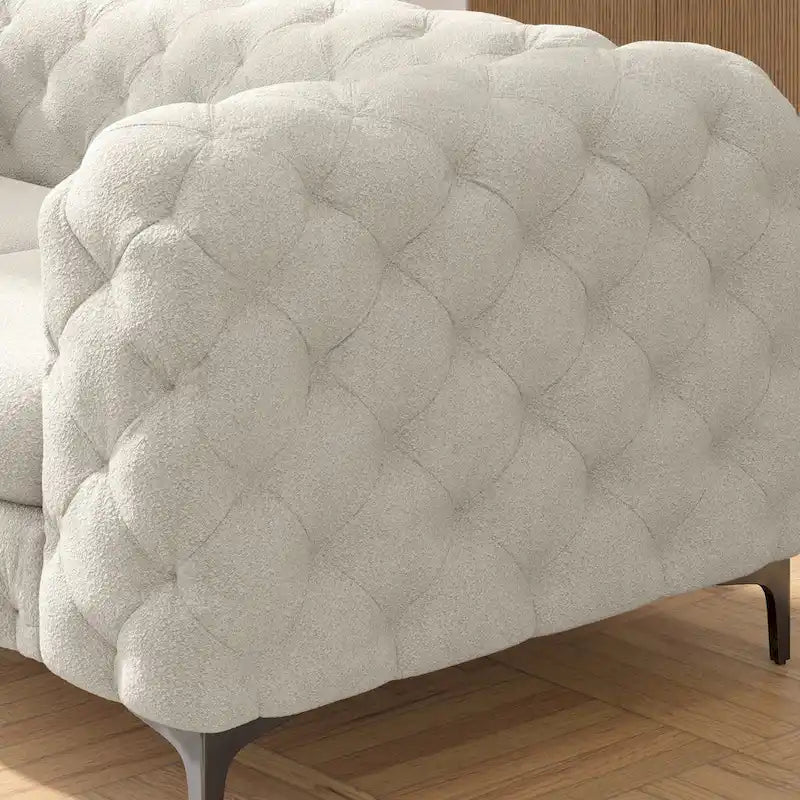 Causeuse Chesterfield capitonnée en velours