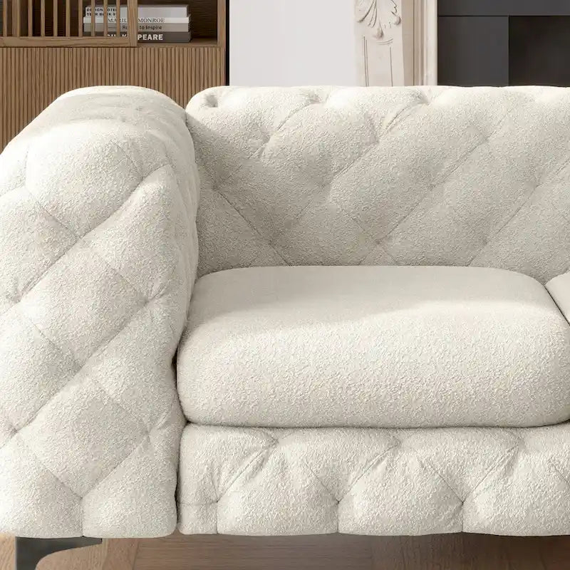 Causeuse Chesterfield capitonnée en velours