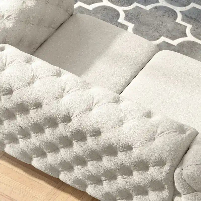 Causeuse Chesterfield capitonnée en velours